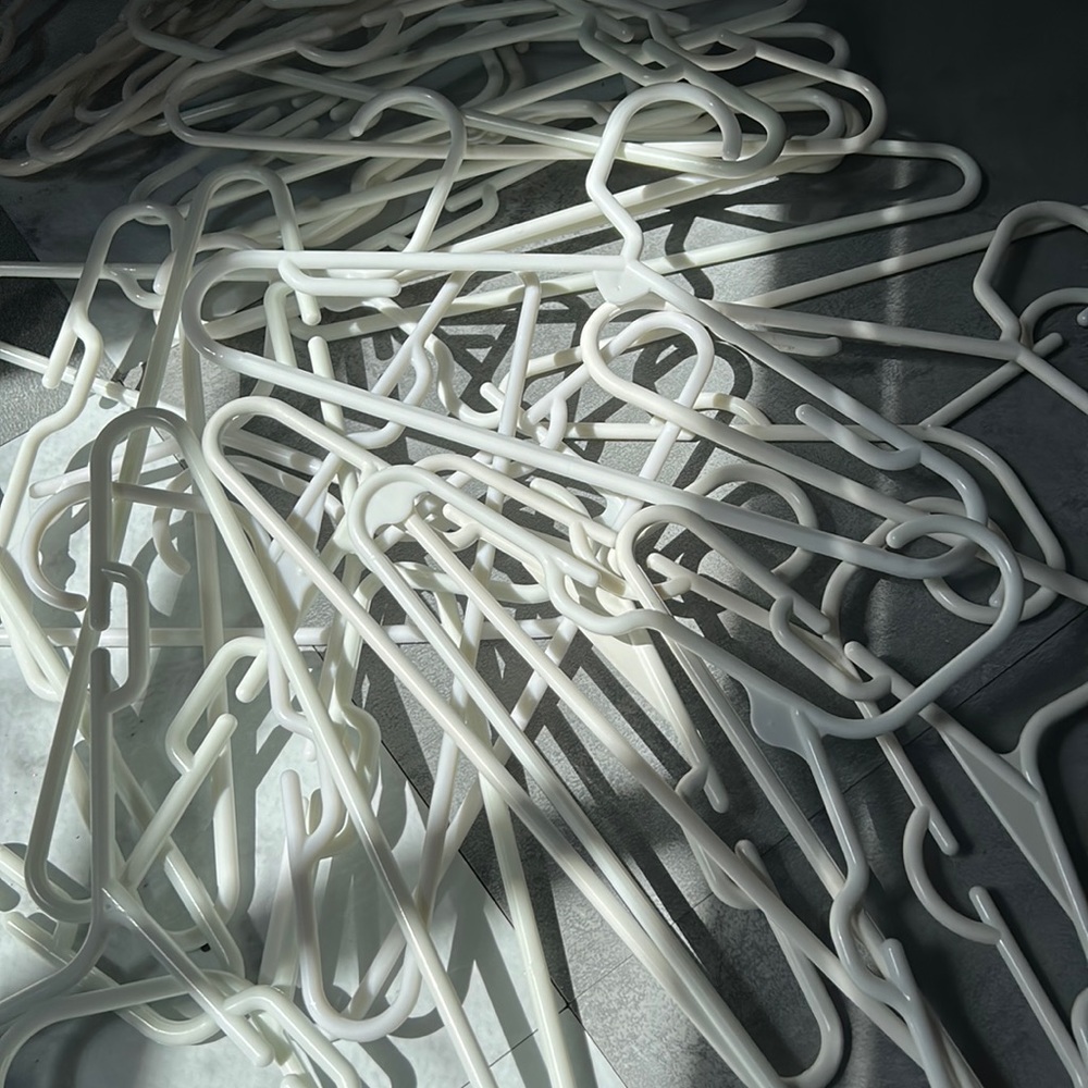 White baby toddler sized plastic closet hangers